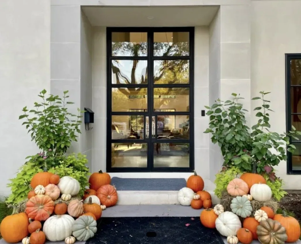 A Wichita front porch styled with real pumpkins and gourds